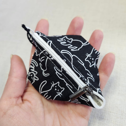 Noma Capsule - Chats noirs et blancs